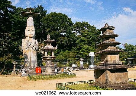 Stock Image - 18 metre standing stone mireukbosal statue? Eunjin Mireuk? with stone lantern. Gwanchoksa Temple. Nonsan. Chungcheongnam-Do. Republic of Korea.. Fotosearch