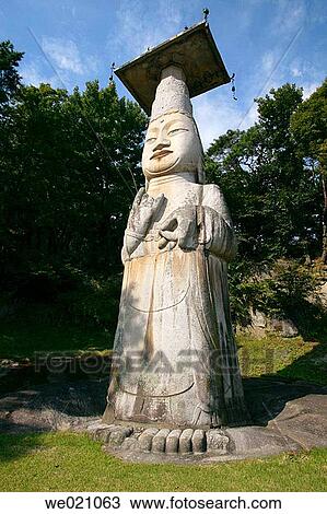 Stock Image - 18 metre standing stone mireukbosal statue? Eunjin Mireuk? with stone lantern. Gwanchoksa Temple. Nonsan. Chungcheongnam-Do. Republic of Korea.. Fotosearch