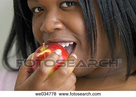 30's, bite, apple, African-American, 20's View Large Photo Image Stock Photo - 30's, bite, apple, African-American, 20's. Fotosearch