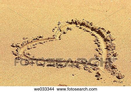 A heart drawn in the sand View Large Photo Image Picture - A heart drawn in the sand. Fotosearch