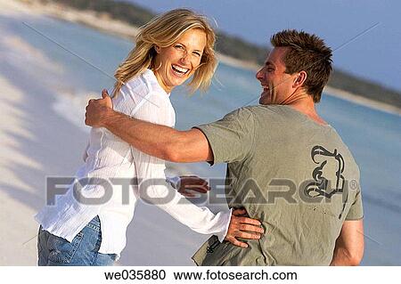 affection, beach, back view, amusement, 30's View Large Photo Image Stock Image - affection, beach, back view, amusement, 30's. Fotosearch