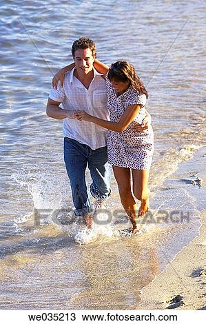 affection, beach, barefoot, amusement, 30's View Large Photo Image Stock Image - affection, beach, barefoot, amusement, 30's. Fotosearch