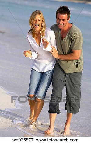 affection, beach, barefoot, amusement, 30's View Large Photo Image Stock Photo - affection, beach, barefoot, amusement, 30's. Fotosearch
