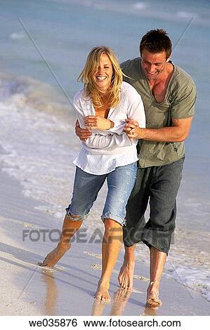 affection, beach, barefoot, amusement, 30's View Large Photo Image Stock Photograph - affection, beach, barefoot, amusement, 30's. Fotosearch