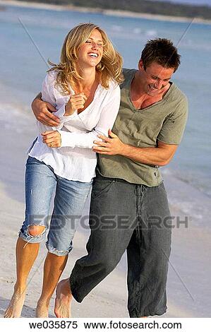 affection, beach, barefoot, amusement, 30's View Large Photo Image Stock Photography - affection, beach, barefoot, amusement, 30's. Fotosearch