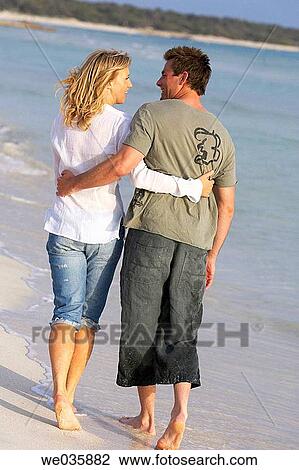 affection, beach, barefoot, back view, 30's View Large Photo Image Stock Image - affection, beach, barefoot, back view, 30's. Fotosearch