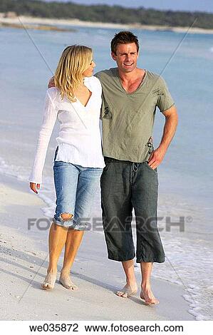 affection, bond, beach, barefoot, 30's View Large Photo Image Stock Image - affection, bond, beach, barefoot, 30's. Fotosearch
