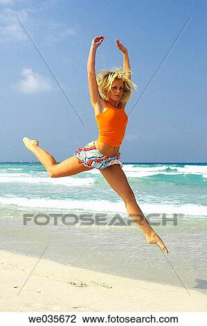 agility, blond, beach, Arms raised, agile View Large Photo Image Stock Image - agility, blond, beach, Arms raised, agile. Fotosearch