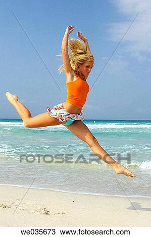 agility, blond, beach, Arms raised, agile View Large Photo Image Stock Image - agility, blond, beach, Arms raised, agile. Fotosearch