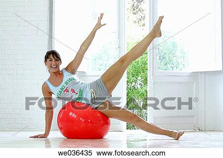 Arms raised, barefoot, ball, balance, 30's View Large Photo Image Stock Photography - Arms raised, barefoot, ball, balance, 30's. Fotosearch