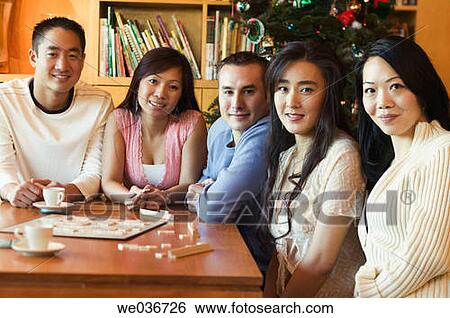 Asian friends playing Scrabble View Large Photo Image Stock Photograph - Asian friends playing Scrabble. Fotosearch