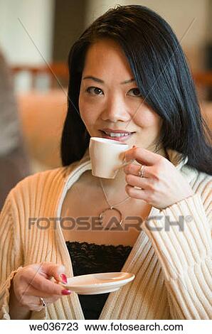 Asian woman with an espresso cup View Large Photo Image Stock Image - Asian woman with an espresso cup. Fotosearch