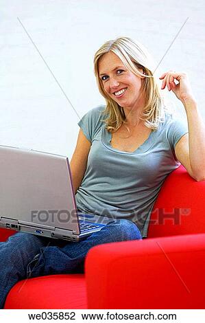 Stock Image - at-home, blond, 30's. Fotosearch