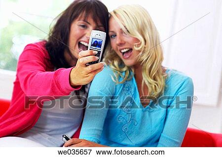 at-home, cell phone, camera, amusement View Large Photo Image Stock Photo - at-home, cell phone, camera, amusement. Fotosearch