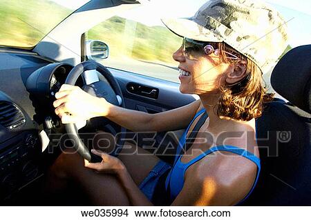 automobile, car, cap, brunette, 30's View Large Photo Image Picture - automobile, car, cap, brunette, 30's. Fotosearch