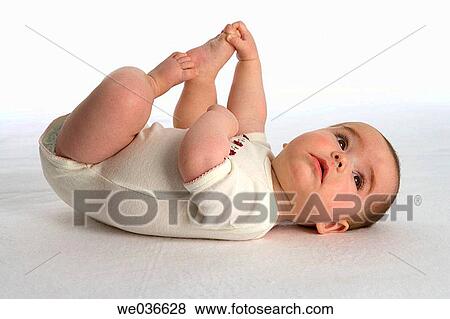 Baby holding toes View Large Photo Image Stock Photo - Baby holding toes. Fotosearch