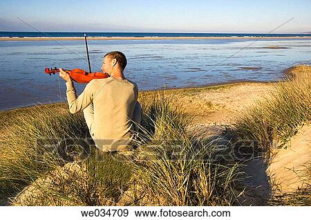 Stock Photo - back view, calm, 30's. Fotosearch
