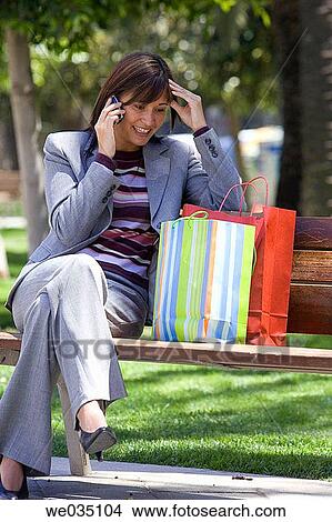 bag, bench, brunette, cell phone View Large Photo Image Picture - bag, bench, brunette, cell phone. Fotosearch