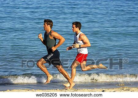 Stock Photography - barefoot, beach, 30's. Fotosearch