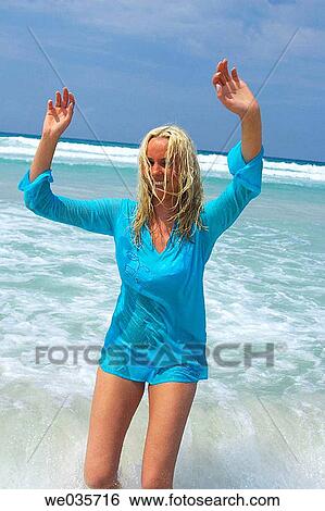 bathe, blond, beach, bathing, Arms raised View Large Photo Image Stock Photograph - bathe, blond, beach, bathing, Arms raised. Fotosearch