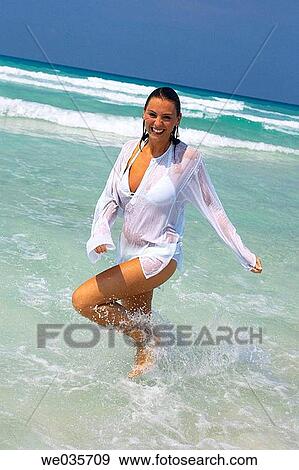 Stock Photo - beach, brunette, amusement. Fotosearch
