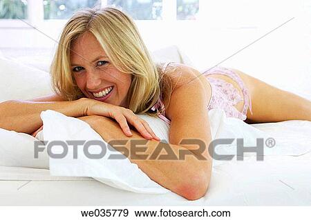 Stock Photo - bed, blond, bedroom, at-home. Fotosearch