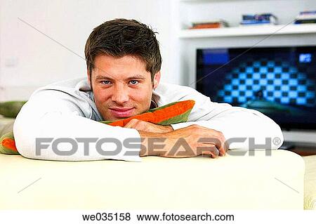 Stock Photo - black hair, blue eyes, at-home. Fotosearch