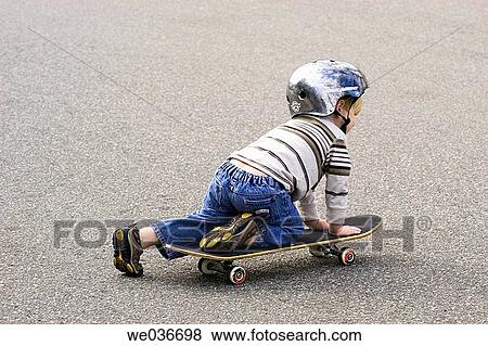 Boy on skateboard View Large Photo Image Stock Photo - Boy on skateboard. Fotosearch