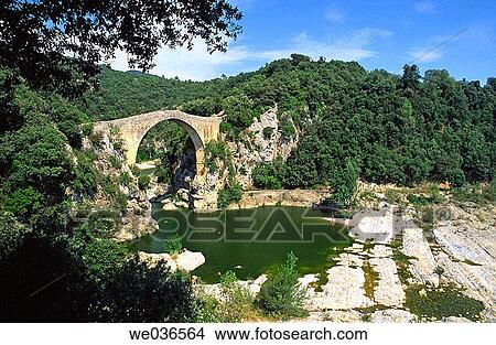 Bridge over Llierca river. Garrotxa Natural Park. Girona province. Catalunya. Spain. View Large Photo Image Picture - Bridge over Llierca river. Garrotxa Natural Park. Girona province. Catalunya. Spain.. Fotosearch
