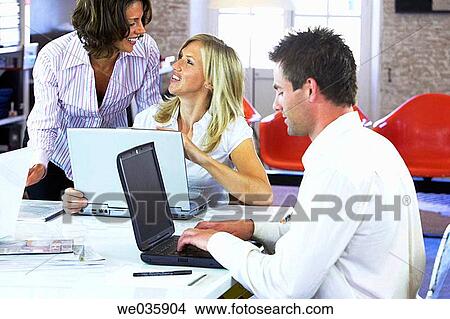 Picture - business, businesswoman, businesspeople, businessman, 30's. Fotosearch