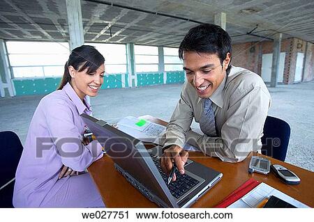 Stock Image - business, businesswoman, businesspeople, businessman, 30's. Fotosearch