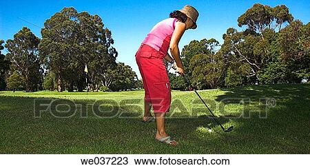 Casual young woman playing golf. View Large Photo Image Stock Image - Casual young woman playing golf.. Fotosearch