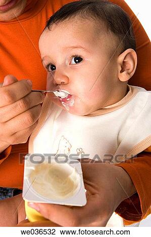 Child eating yoghurt View Large Photo Image Stock Image - Child eating yoghurt. Fotosearch