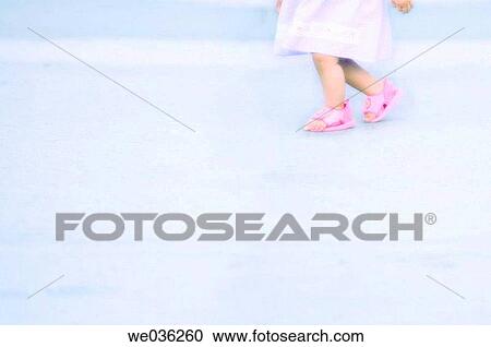 Stock Image - Child walking. Feet abstract. July 2005, Virginia, USA. Fotosearch