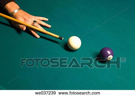 Close-up of a man's hand getting ready to hit the cue ball with his cue stick View Large Photo Image Stock Photo - Close-up of a man's hand getting ready to hit the cue ball with his cue stick. Fotosearch