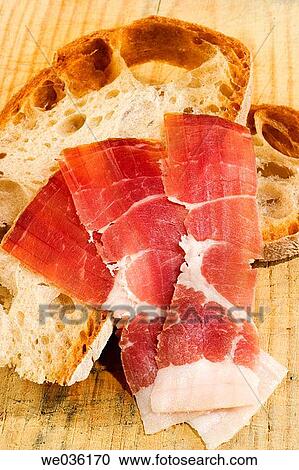 Cured ham with bread View Large Photo Image Stock Image - Cured ham with bread. Fotosearch