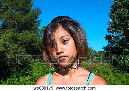 Dark skin teen girl, at a park, posing View Large Photo Image Stock Photo - Dark skin teen girl, at a park, posing. Fotosearch
