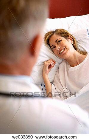 Stock Image - Doctor and patient in hospitalization. Fotosearch