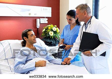 Picture - Doctors and patient in hospitalization. Fotosearch