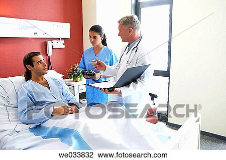 Doctors and patient in hospitalization View Large Photo Image Stock Image - Doctors and patient in hospitalization. Fotosearch