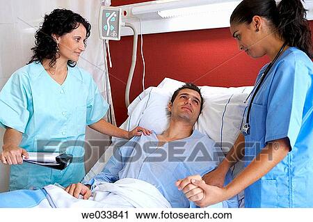 Doctors and patient in hospitalization View Large Photo Image Stock Image - Doctors and patient in hospitalization. Fotosearch