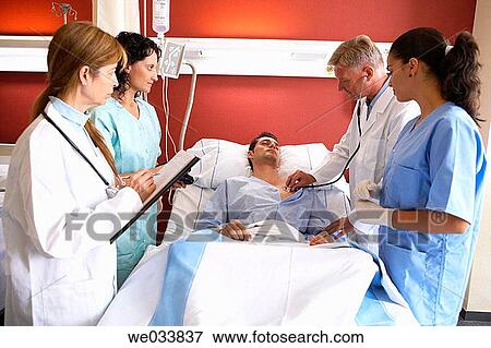 Doctors and patient in hospitalization View Large Photo Image Stock Photo - Doctors and patient in hospitalization. Fotosearch