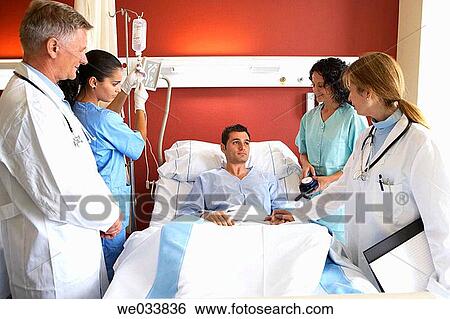 Doctors and patient in hospitalization View Large Photo Image Stock Photograph - Doctors and patient in hospitalization. Fotosearch