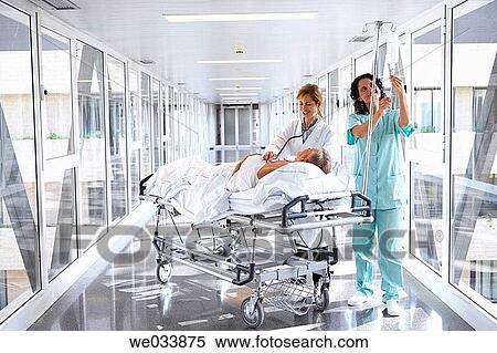 Doctors and patient in hospitalization View Large Photo Image Stock Photography - Doctors and patient in hospitalization. Fotosearch
