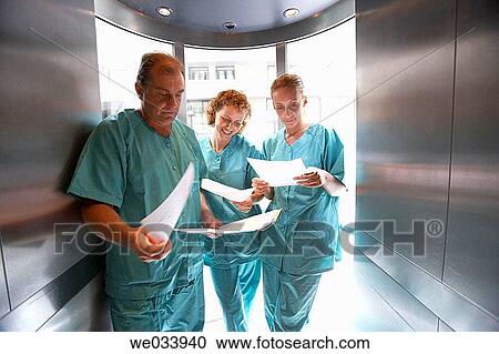 Stock Image - Doctors in lift. Fotosearch