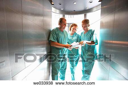 Stock Photo - Doctors in lift. Fotosearch