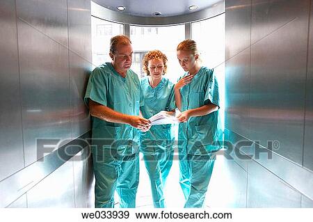 Stock Photo - Doctors in lift. Fotosearch