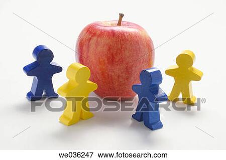Stock Photo - Figures and apple. Fotosearch