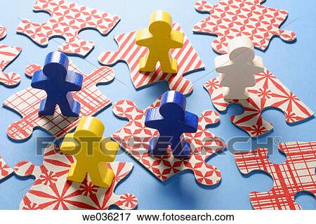 Stock Photo - Figures and jigsaw puzzles. Fotosearch