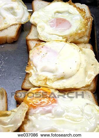 Fried eggs View Large Photo Image Stock Photograph - Fried eggs. Fotosearch